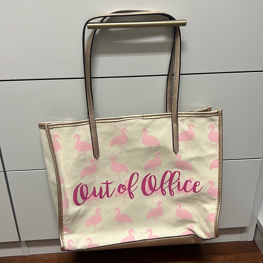 “Out Of Office” NWOT Tote with Rose gold handles + lining. Lots of small pockets